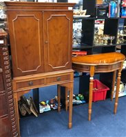 Lot 458 - A STAINED WOOD DRINKS CABINET AND A DEMI LUNE SIDE TABLE