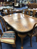 Lot 459 - A BURR WALNUT EXTENDING DINING TABLE AND SIX CHAIRS