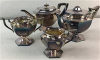 Lot 502 - A THREE PIECE PLATED TEA SERVICE AND ANOTHER TEAPOT