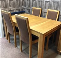 Lot 486 - AN ERCOL EXTENDING DINING TABLE AND FOUR CHAIRS