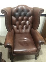 Lot 1823 - A BROWN LEATHER THREE PIECE WING BACK SUITE