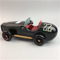 Lot 110 - A MODEL RACING CAR, BOOKENDS, FISH KNIVES AND FORKS