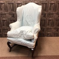 Lot 108 - A WING BACK ARMCHAIR AND AN OCCASIONAL TABLE