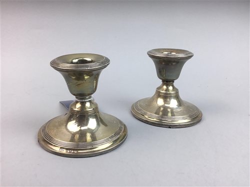 Lot 67 - A PAIR OF SILVER DWARF CANDLESTICKS, INKWELL AND NAPKIN RINGS