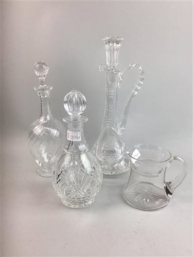 Lot 233 - THREE CUT GLASS DECANTERS, TWO VASES AND A GLASS JUG