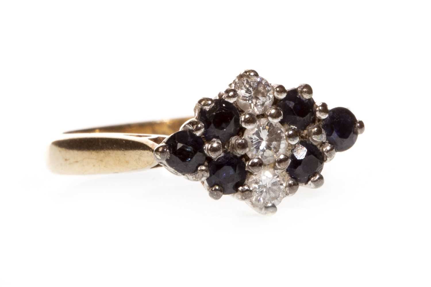 Lot 42 - A BLUE GEM AND DIAMOND CLUSTER RING