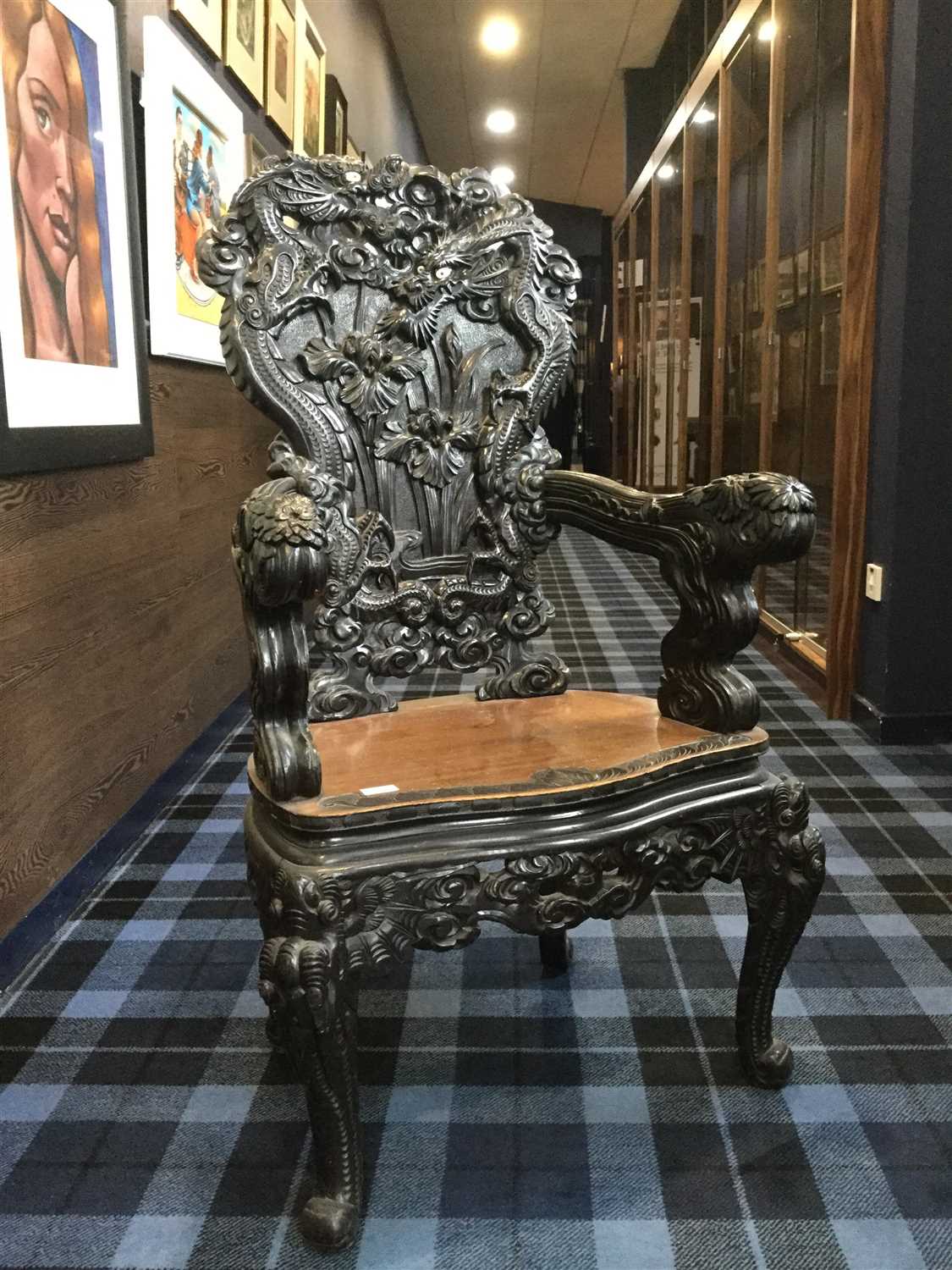 Lot 1027 - A CARVED WOOD ARMCHAIR