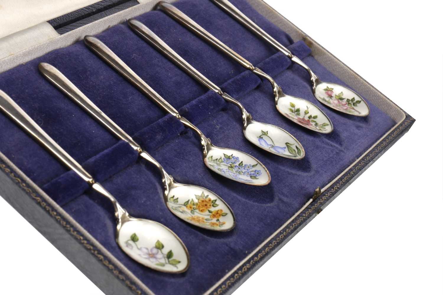 Lot 818 - A SET OF SIX SILVER AND FLORAL ENAMEL TEASPOONS