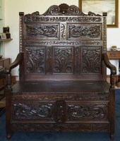 Lot 1091 - VICTORIAN CARVED OAK BOX SEAT HALL SETTLE the...