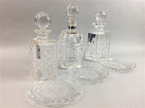 Lot 26 - A SILVER MOUNTED CRYSTAL DECANTER, PLATES AND TWO OTHER DECANTERS