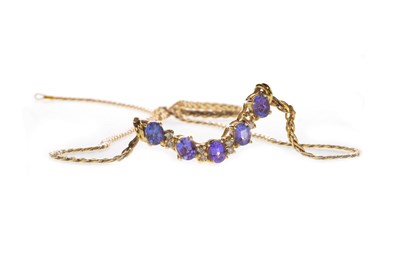 Lot 127 - A TANZANITE AND DIAMOND NECKLET
