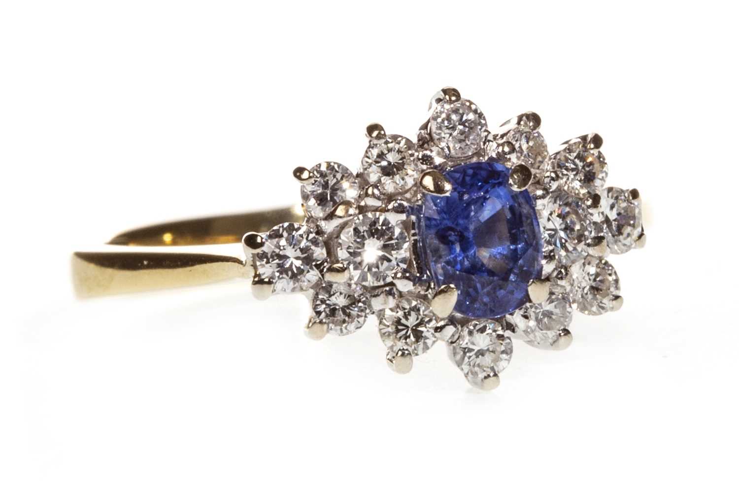 Lot 165 - A BLUE GEM AND DIAMOND CLUSTER RING