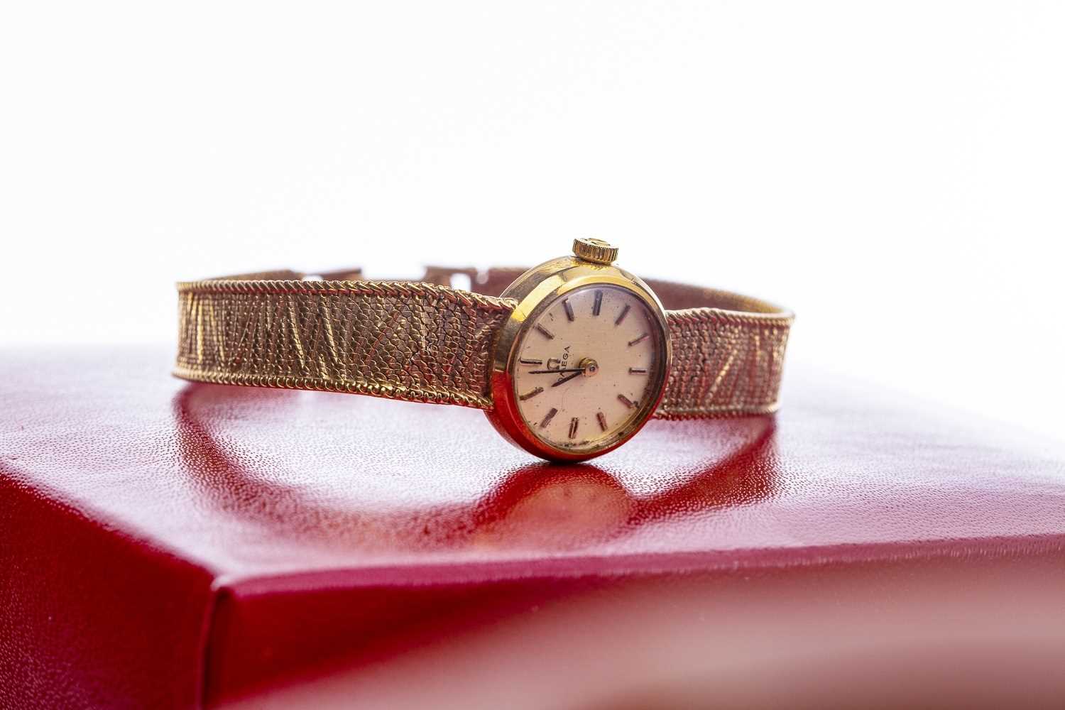 Lot 833 - A LADY'S OMEGA GOLD COCKTAIL WATCH
