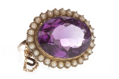 Lot 207 - AN AMETHYST AND SEED PEARL BROOCH