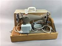 Lot 120 - A JANOME SEWING MACHINE AND SET OF FOUR LAWN BOWLS