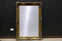 Lot 1192 - OBLONG BEVELLED WALL MIRROR the moulded gilt...