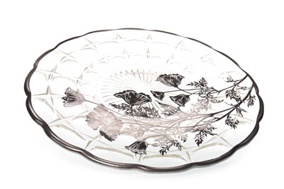 Lot 371 - A SILVER-OVERLAID GLASS CIRCULAR PLATE