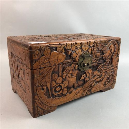 Lot 244 - AN EARLY 20TH CENTURY CHINESE CARVED WOOD BOX WITH TWO TREEN BALLS