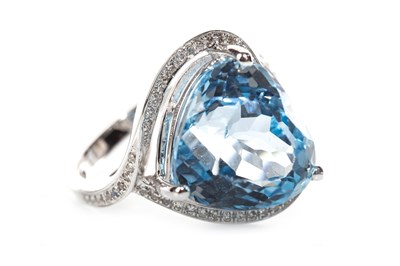 Lot 267 - A HEART SHAPED BLUE TOPAZ AND DIAMOND RING