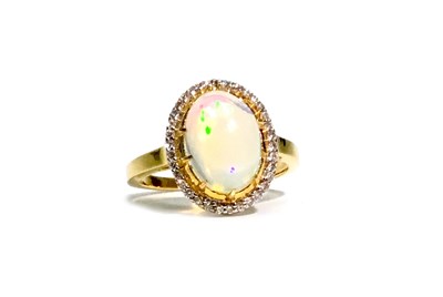 Lot 303 - AN OPAL AND DIAMOND RING
