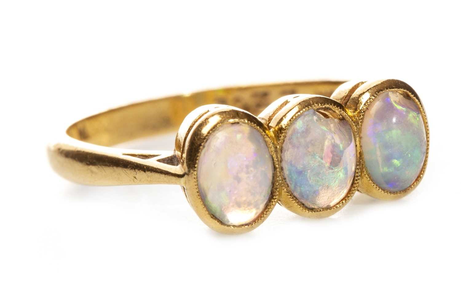Lot 89 - AN EARLY 20TH CENTURY OPAL THREE STONE RING