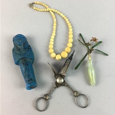 Lot 1 - AN EGYPTIAN FIGURE, CANDLE SNUFFER, GREEN HARDSTONE AND ENAMEL FLOWER AND BEADS