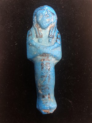 Lot 1 - AN EGYPTIAN FIGURE, CANDLE SNUFFER, GREEN HARDSTONE AND ENAMEL FLOWER AND BEADS
