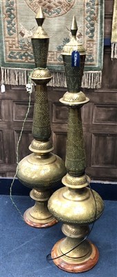 Lot 227 - A PAIR OF EASTERN BRASS FLOOR STANDING LAMPS