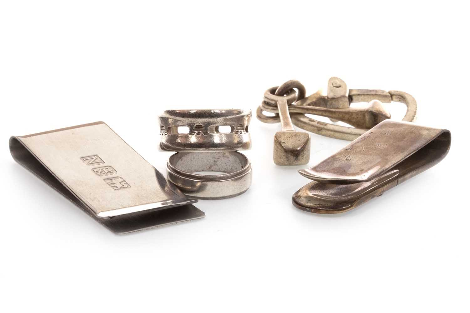 Lot 127 - TWO SILVER RINGS, TWO SILVER MONEY CLIPS AND A KEYRING