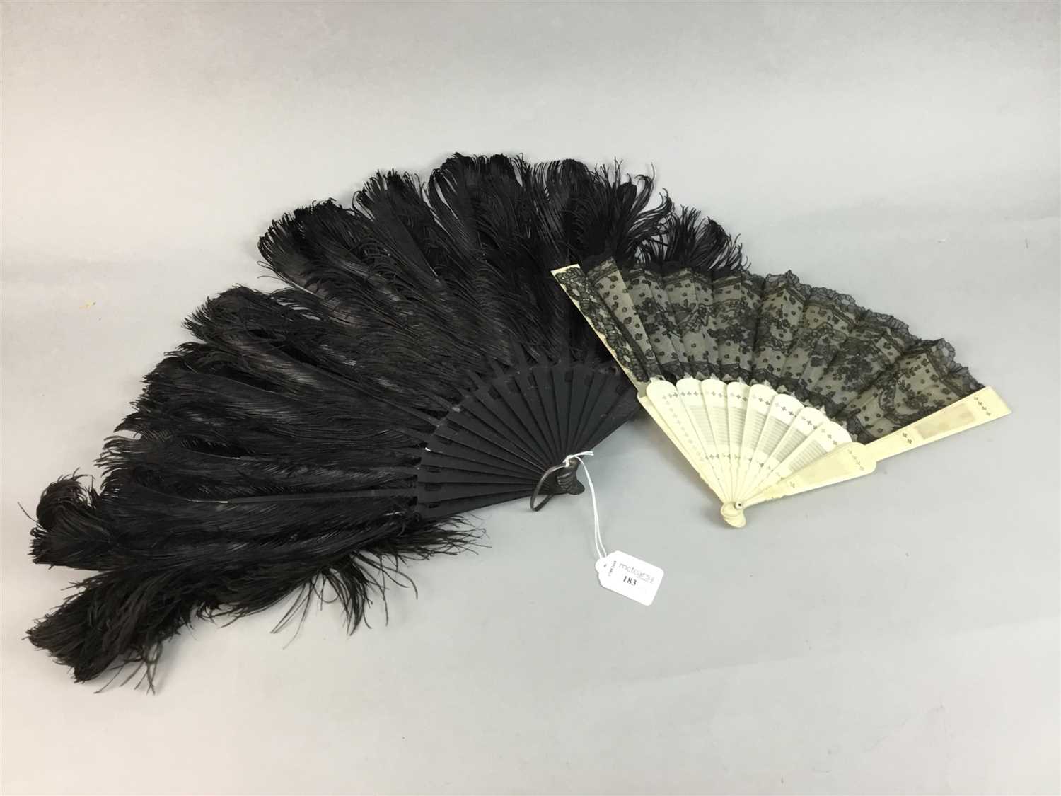 Lot 183 - AN OSTRICH FEATHER FAN AND A BONE AND LACE FAN