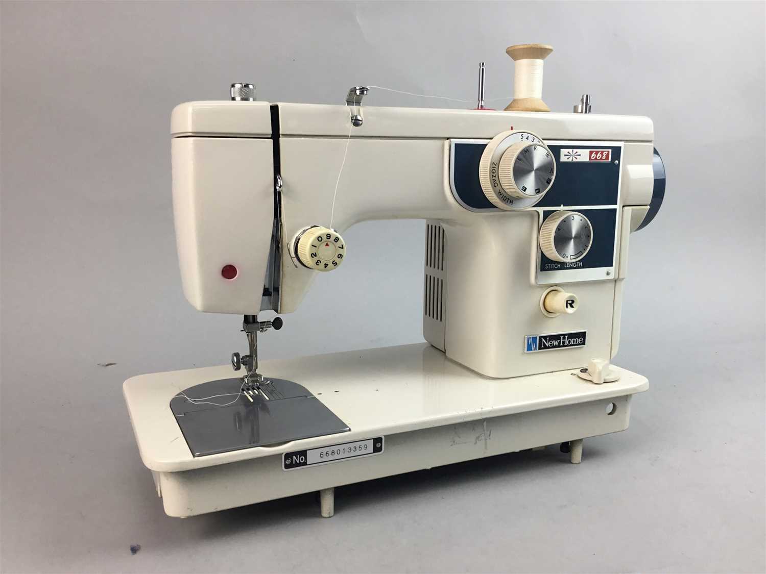 Lot 319 - A VINTAGE SEWING MACHINE, TWO PROJECTORS, FILM REELS AND A SCREEN