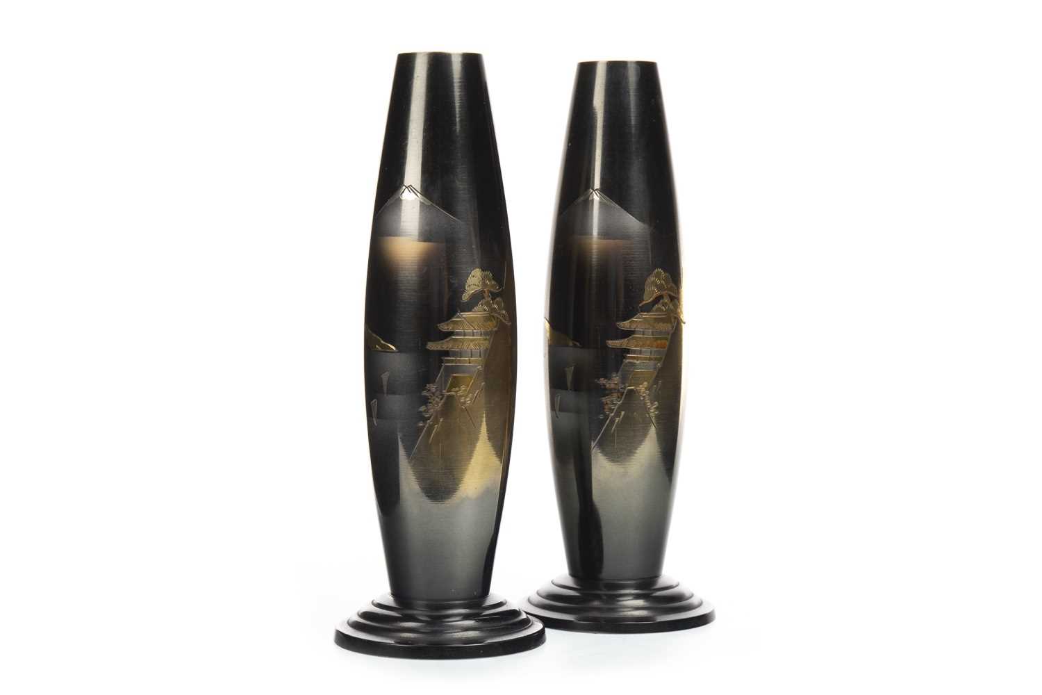 Lot 1057 - A PAIR OF JAPANESE BRONZE BULLET SHAPED VASES