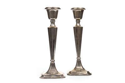 Lot 844 - A PAIR OF GEORGE V SILVER CANDLESTICKS
