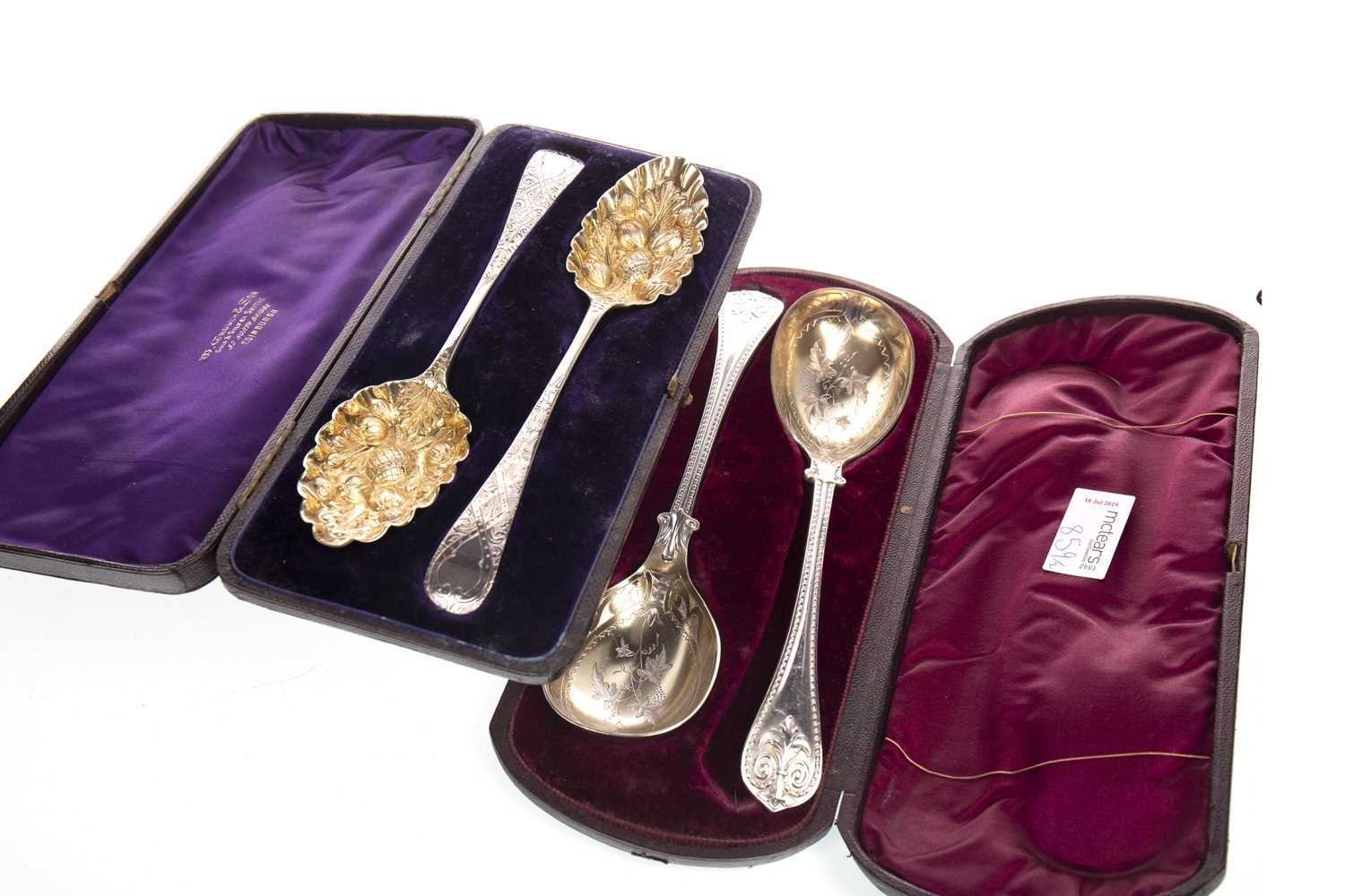 Lot 859 - A PAIR OF GEORGE III SILVER AND PARCEL GILT SERVING SPOONS AND ANOTHER PAIR OF SPOONS