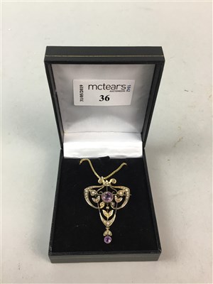 Lot 36 - AN EDWARDIAN AMETHYST AND SEED PEARL HOLBEIN
