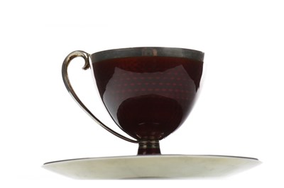 Lot 870 - A NORWEGIAN SILVER AND CRIMSON GUILLOCHE ENAMEL CUP AND SAUCER BY MARIUS HAMMER