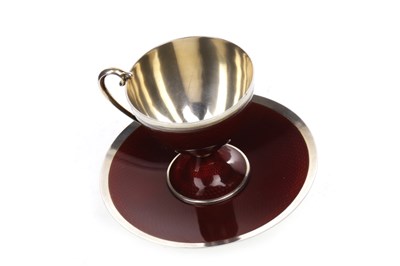 Lot 870 - A NORWEGIAN SILVER AND CRIMSON GUILLOCHE ENAMEL CUP AND SAUCER BY MARIUS HAMMER