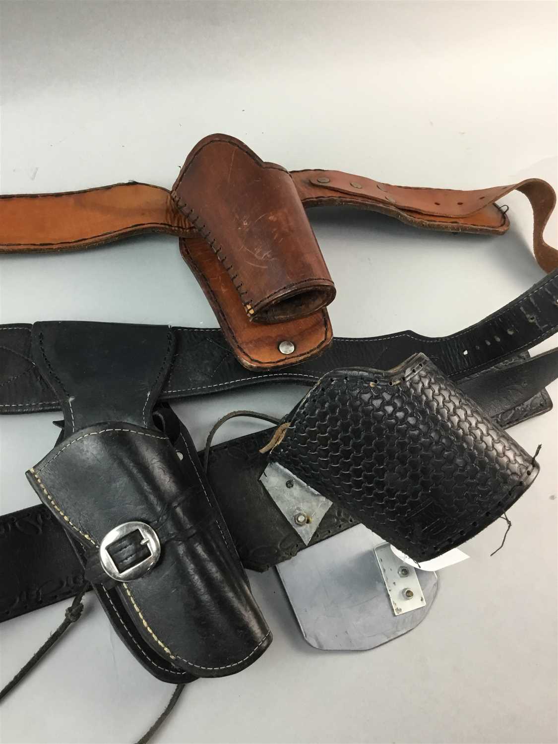 Lot 184 - A COLLECTION OF THREE LEATHER GUN BELTS