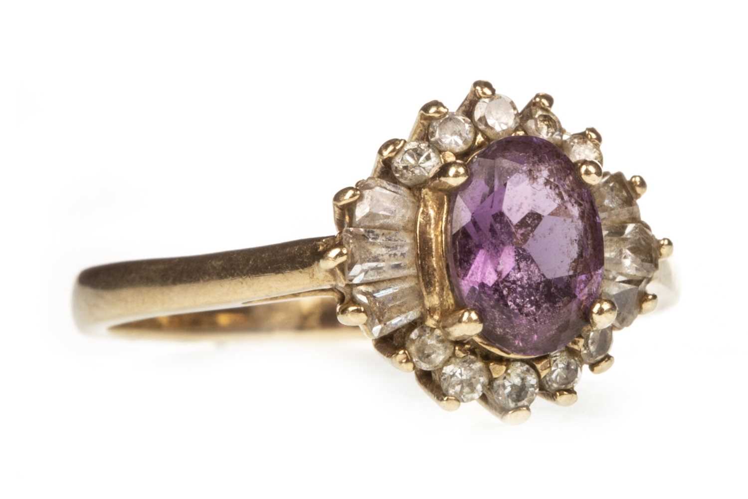 Lot 100 - A PURPLE AND WHITE GEM SET RING