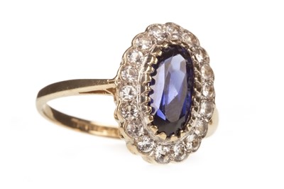 Lot 133 - A BLUE AND WHITE GEM SET RING