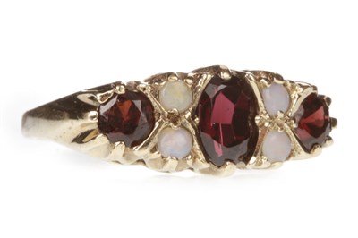 Lot 139 - A RED GEM SET AND OPAL RING