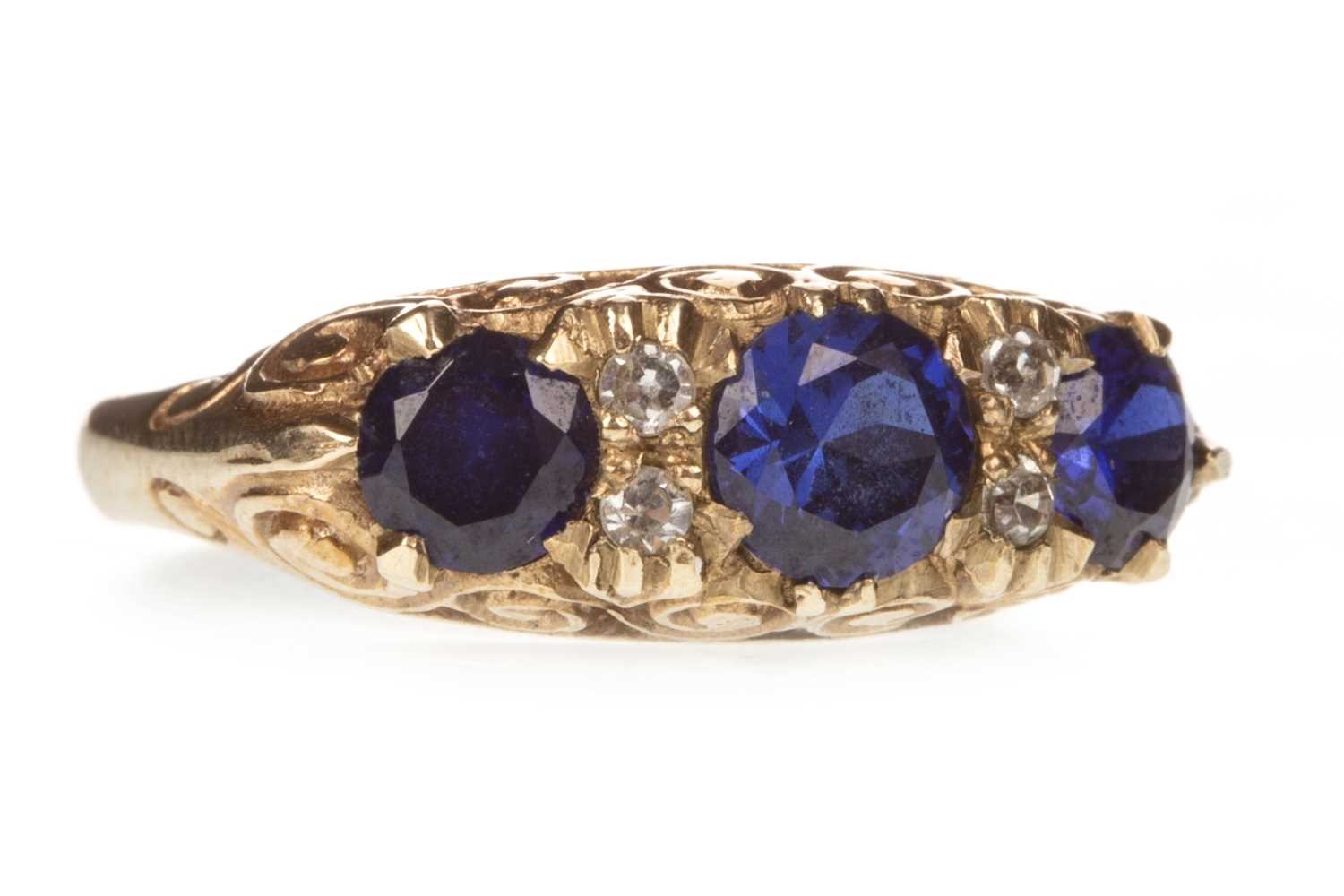 Lot 165 - A BLUE AND WHITE GEM SET RING