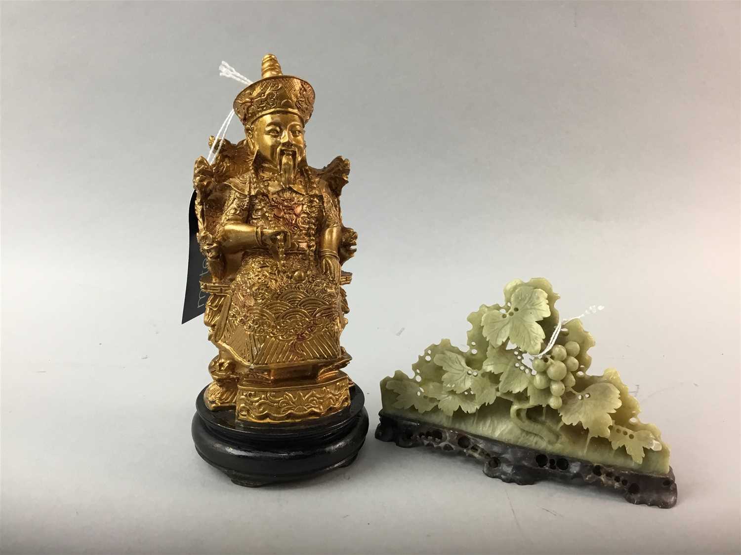 Lot 267 - AN EARLY 20TH CENTURY GILDED COMPOSITION FIGURE ALONG WITH A SOAPSTONE FIGURE