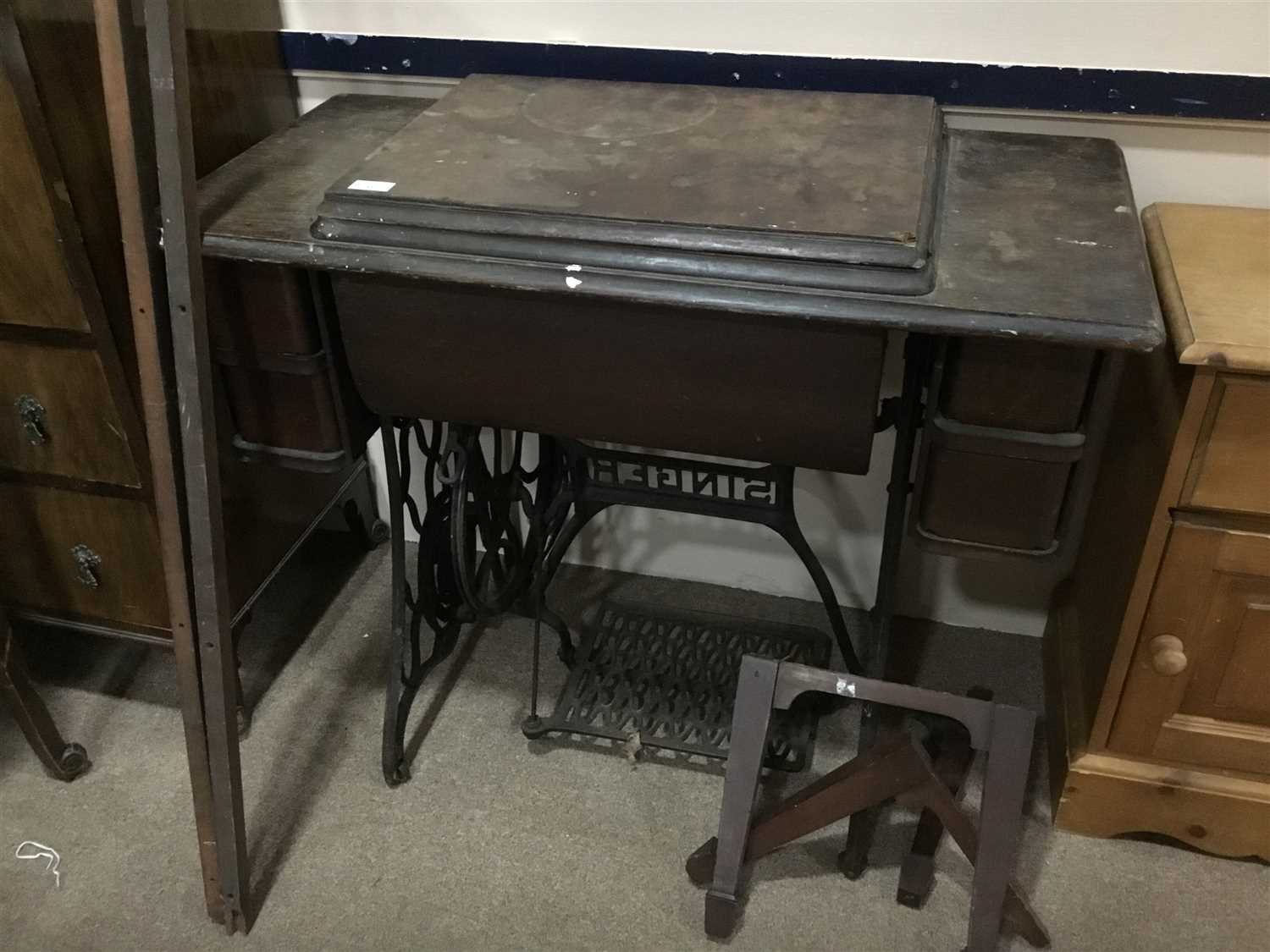 Lot 327 - A TREADLE SEWING MACHINE TABLE