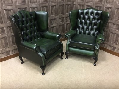 Lot 1635 - A PAIR OF GREEN LEATHER WING BACK ARMCHAIRS