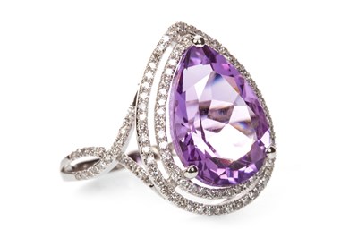 Lot 74 - AN AMETHYST AND DIAMOND RING