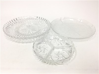 Lot 1755 - A SET OF FOUR GLASS CIRCULAR SERVING PLATES AND CRYSTAL DISHES