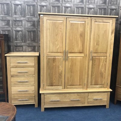 Lot 260 - AN OAK THREE DOOR WARDROBE AND AN OAK CHEST OF DRAWERS