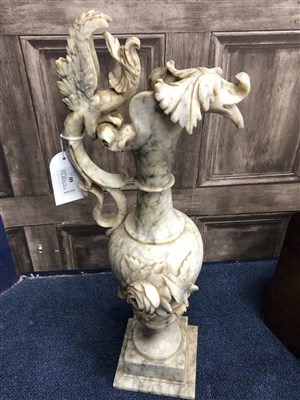 Lot 60 - A PAIR OF VEINED MARBLE EWERS