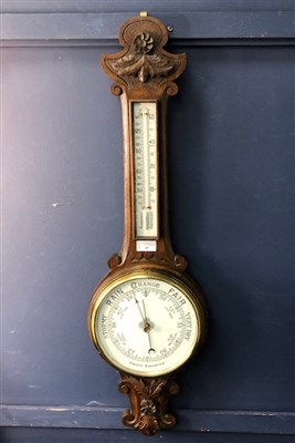 Lot 43 - A STAINED WOOD WALL BAROMETER